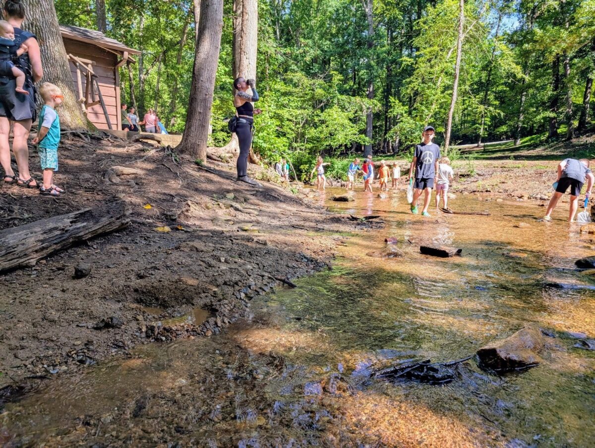Group of homeschool community gathered outdoors for a park day meetup